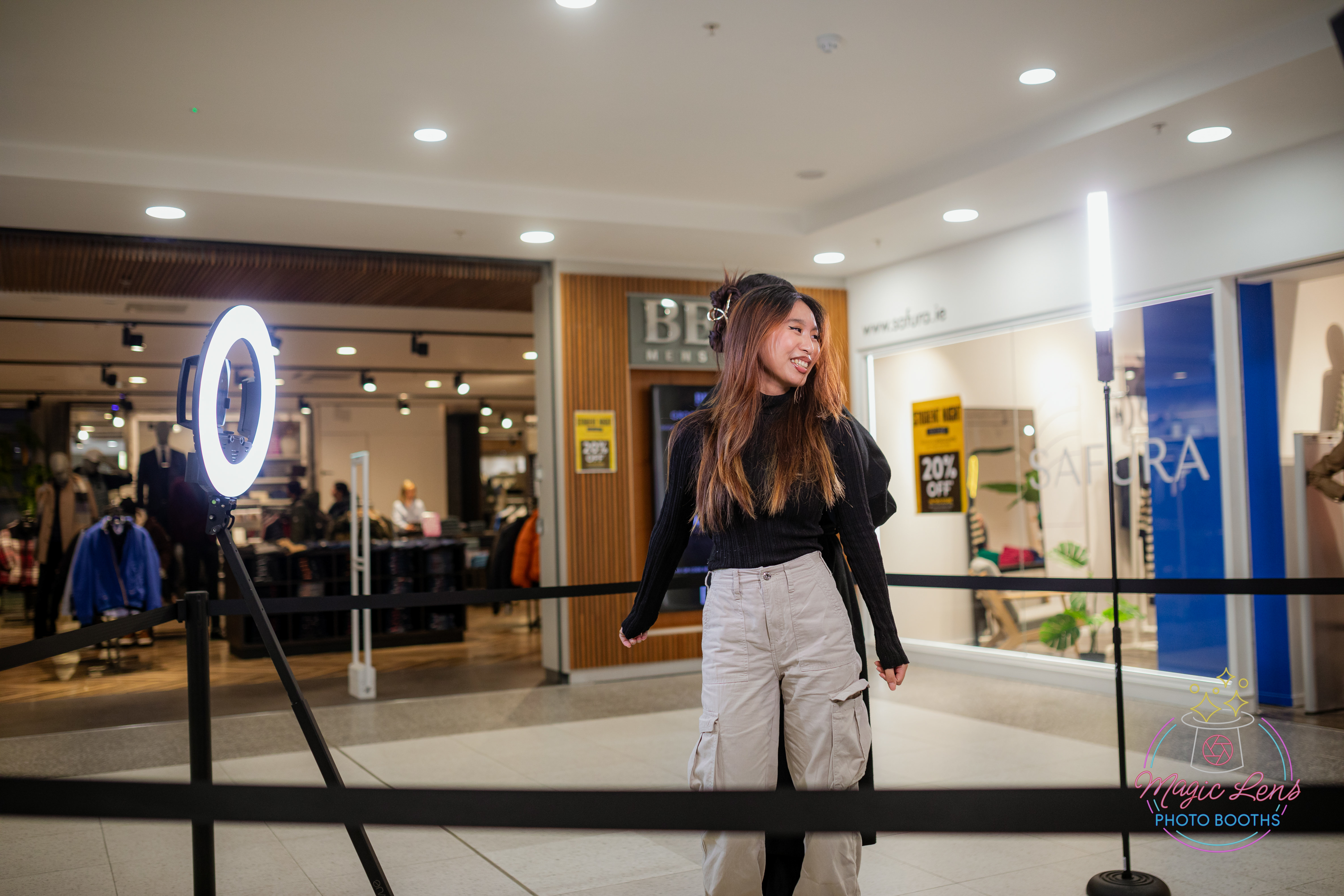 Guests at an event enjoying taking photos on the 360 booth